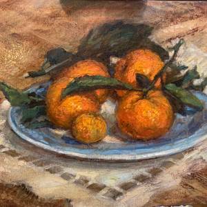Tangerines with leaves on blue china sultry taste in winter