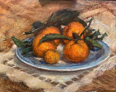 Tangerines with leaves on blue china sultry taste in winter