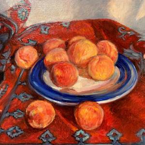 Plate of peaches on  red carpet